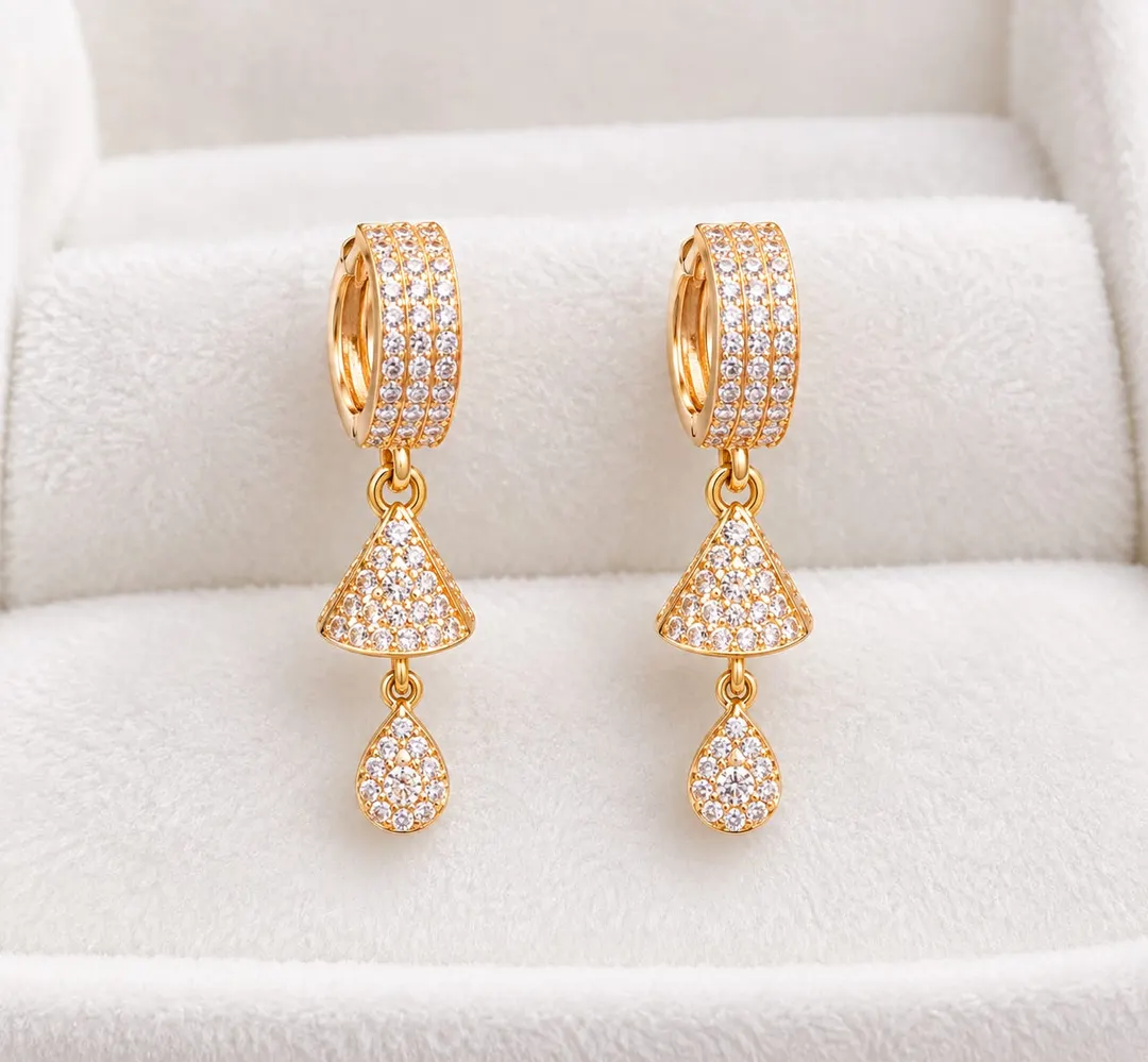 GOLD-PLATED CZ STUDDED GEOMETRIC DROP EARRINGS.