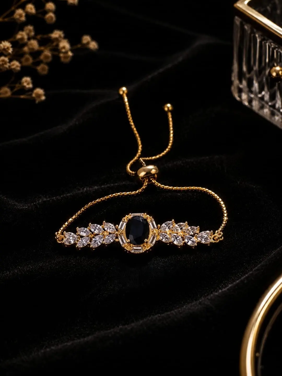 GOLD-TONE BLACK CENTER STONE AND CRYSTAL HALO ADJUSTTABLE BRACELET