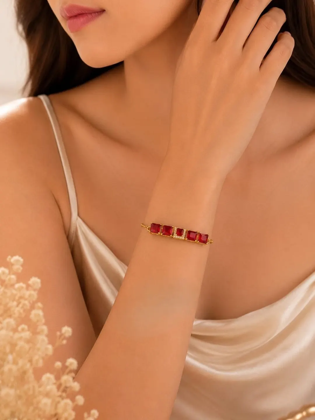 RUBY RED RECTANGULAR STONE GOLD-PLATED BRACELET.