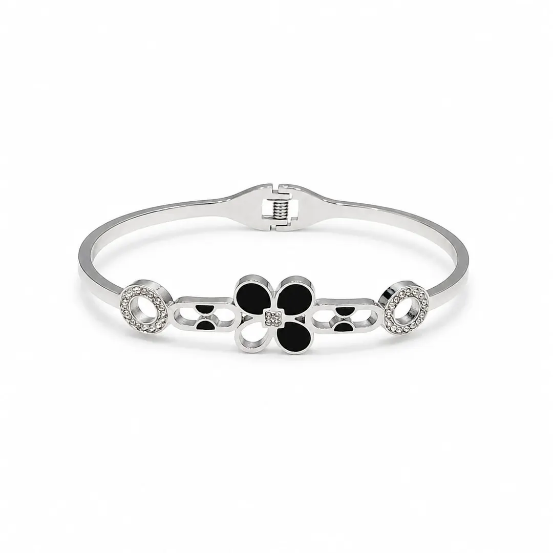 SILVER-TONE BLACK CLOVER HINGED BRACELET.