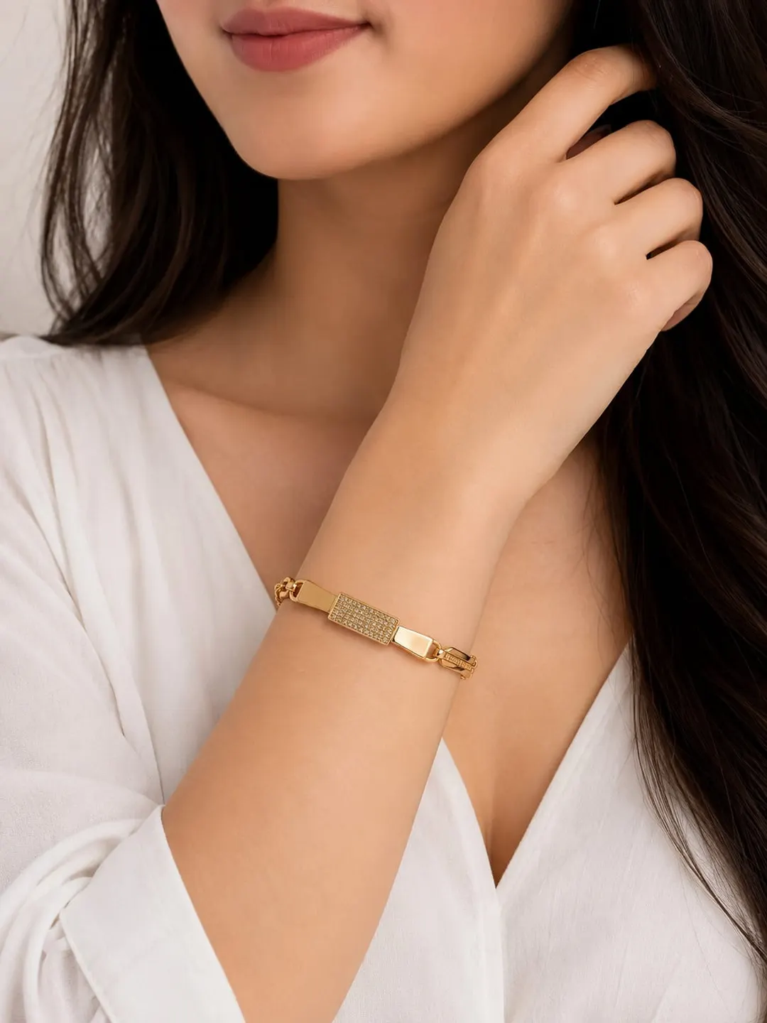 GOLD PLATED CUBIC ZIRCONIC [CZ] AMERICAN DIAMOND STUDDED BOW DESIGN BRACELET.
