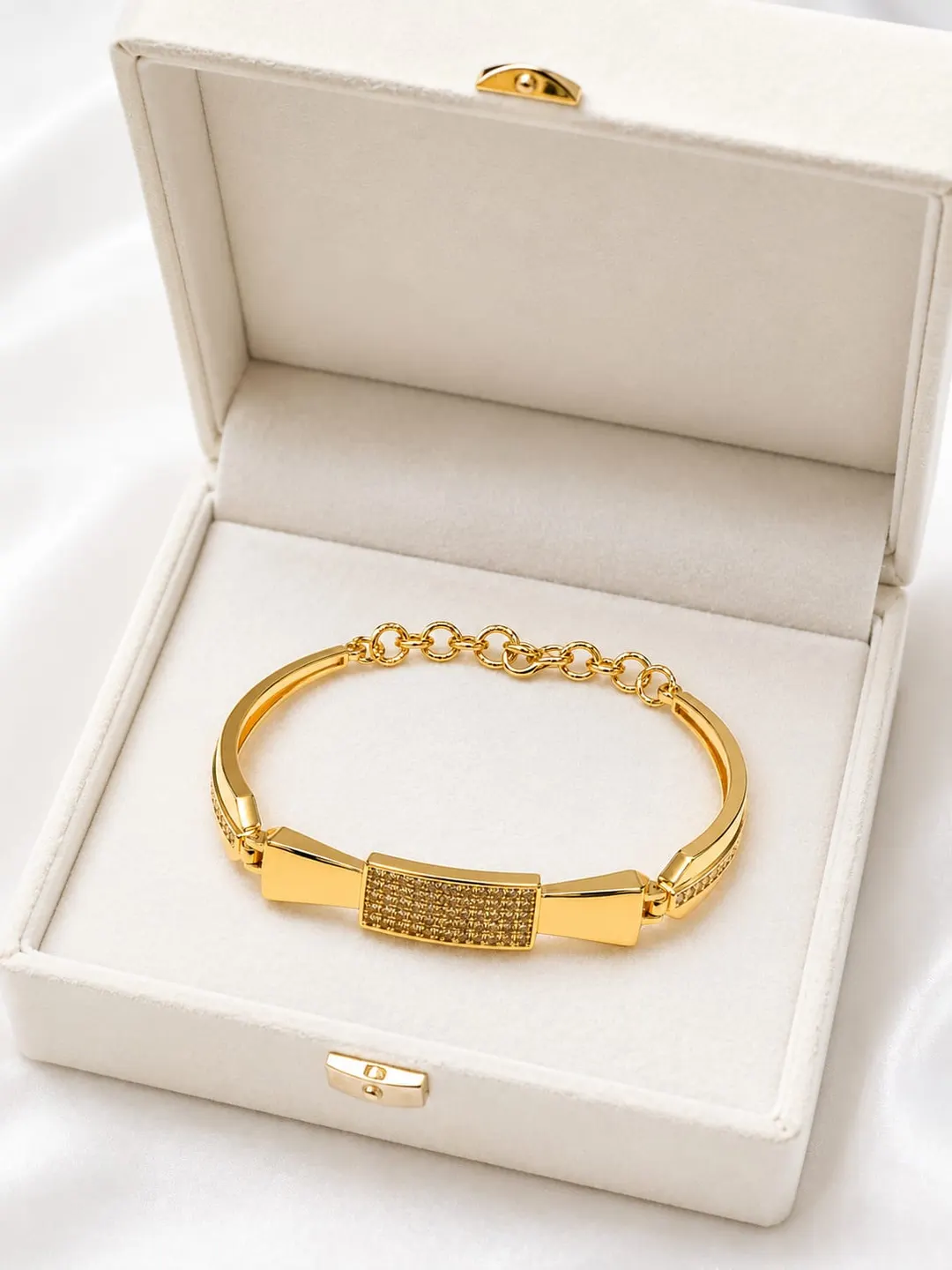 GOLD PLATED CUBIC ZIRCONIC [CZ] AMERICAN DIAMOND STUDDED BOW DESIGN BRACELET.