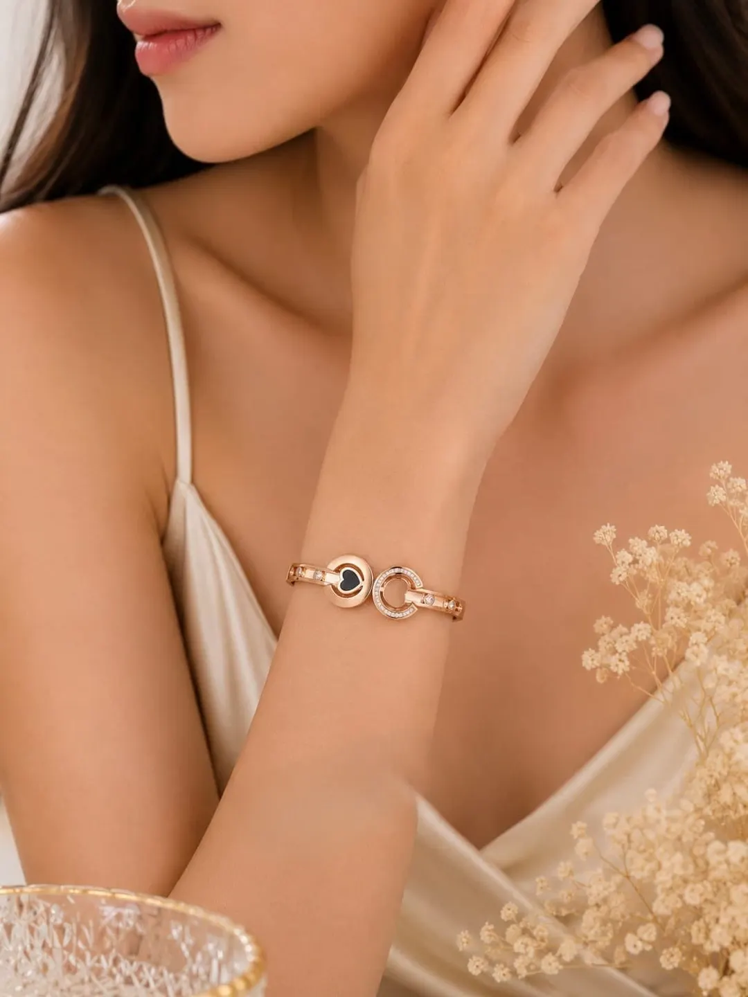 ROSE GOLD PLATED DUAL HEART C-SHAPE STAINLESS STEEL BRACELET.