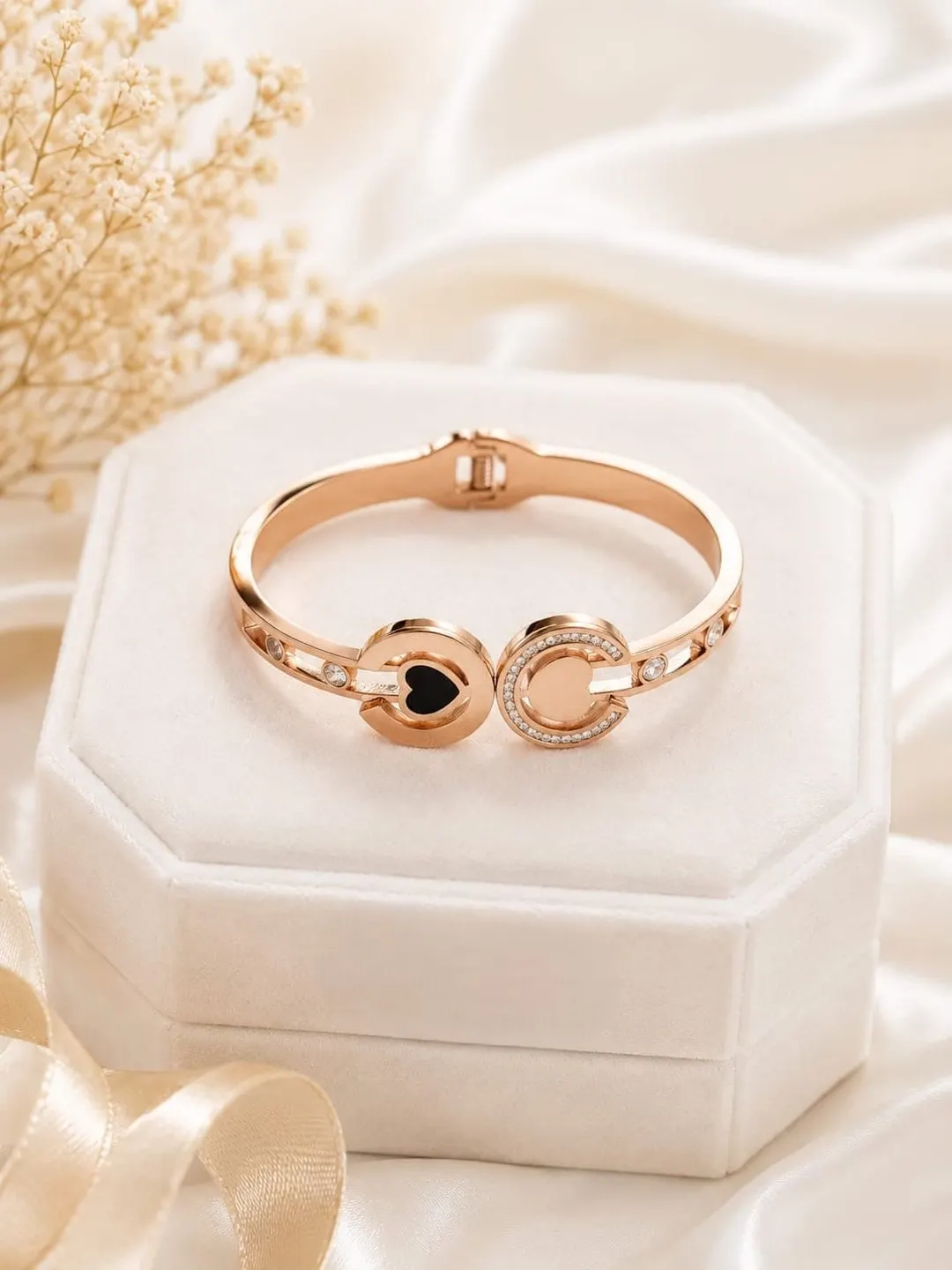 ROSE GOLD PLATED DUAL HEART C-SHAPE STAINLESS STEEL BRACELET.