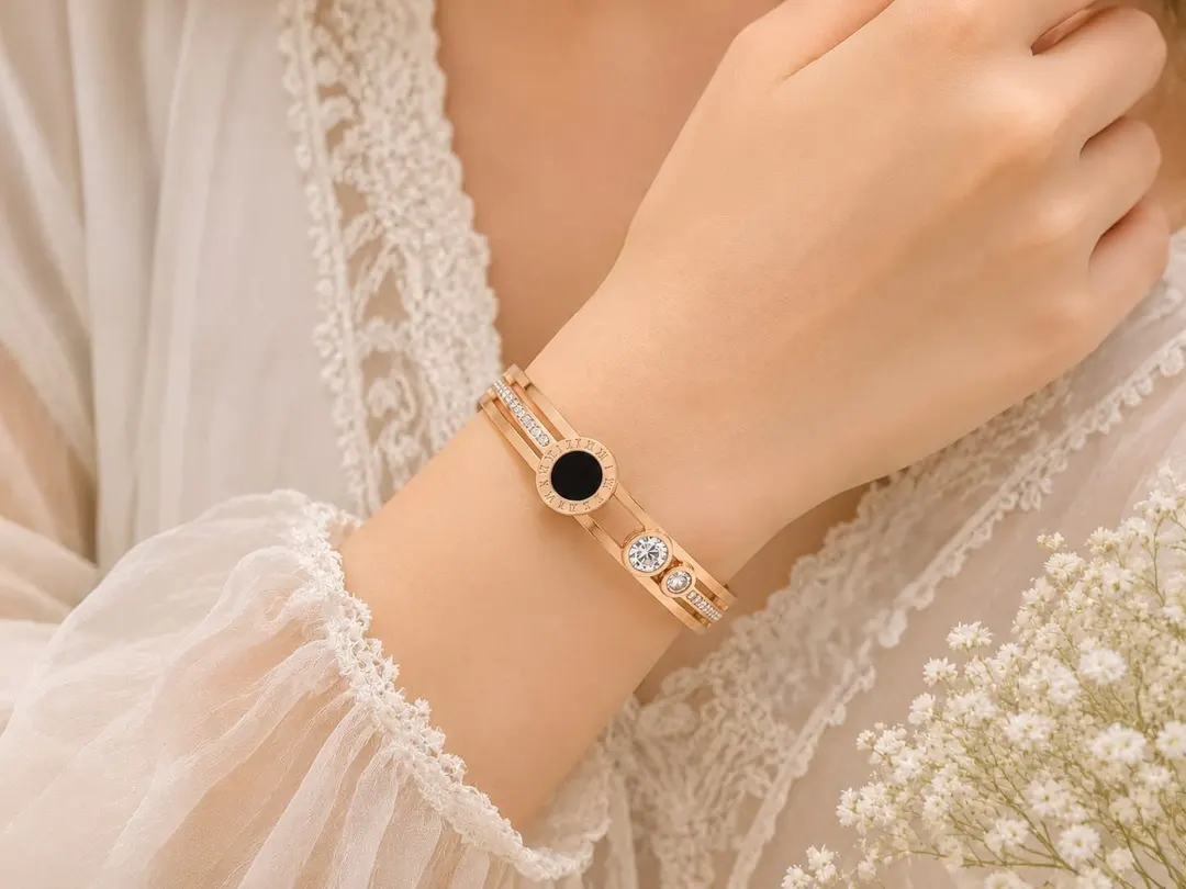 GOLD PLATED ROMAN NUMERAL STAINLESS STEEL CUFF BRACELET.