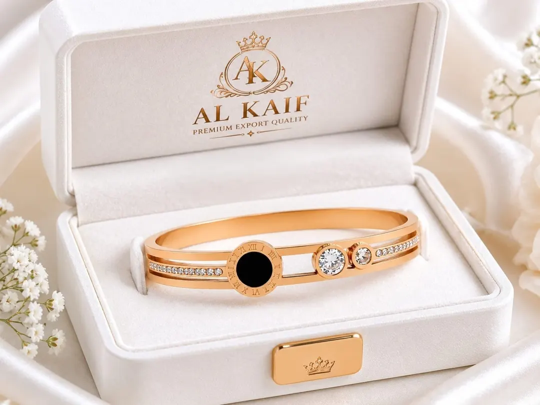 GOLD PLATED ROMAN NUMERAL STAINLESS STEEL CUFF BRACELET.