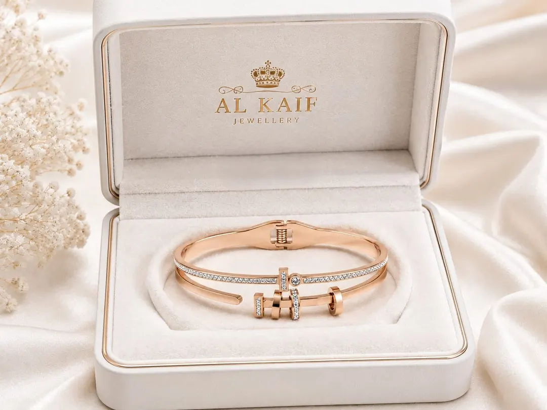 ROSE GOLD PLATED TITANIUM STAINLESS STEEL HINGED BRACELET.