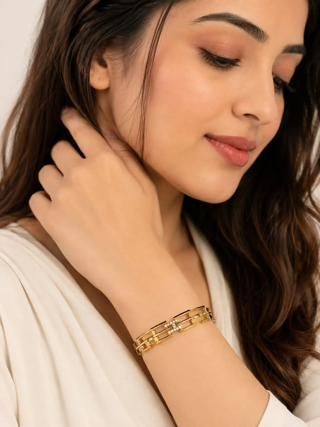 ROSE GOLD PLATED GEOMETRIC LINK HINGED BRACELET.