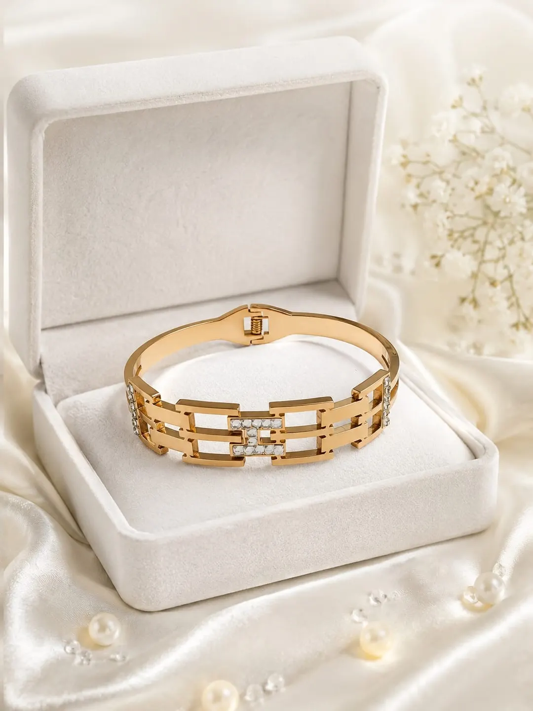 ROSE GOLD PLATED GEOMETRIC LINK HINGED BRACELET.