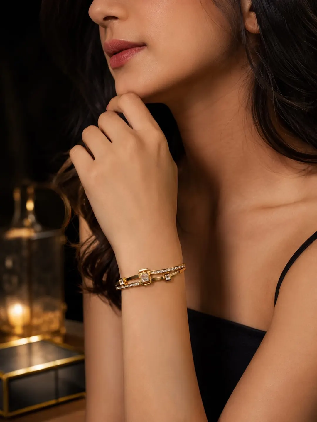 GOLD PLATED FINISHES , DUAL- BAND STRUCTURES, AND GEOMETRIC STONE ACCENTS.