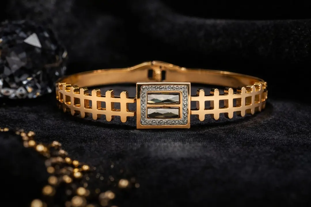 GOLD PLATED GEOMETRIC CRYSTAL BRACELETS AND STRUCTURED CUFFS.