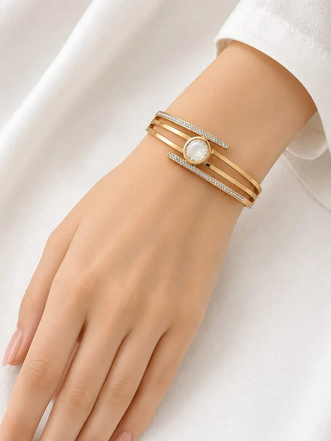 ROSE GOLD CRYSTAL WRAP BRACELET FEATURE SPLIT BAND DESIGN AND SPARKLING CENTER CRYSTAL DIAMOND.