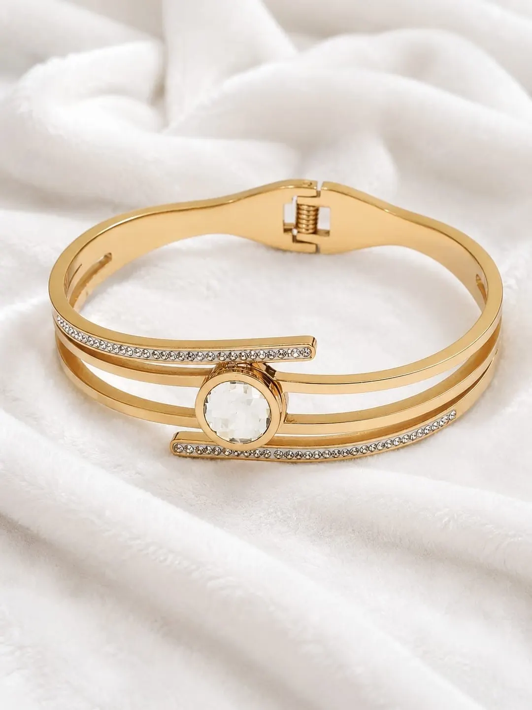 ROSE GOLD CRYSTAL WRAP BRACELET FEATURE SPLIT BAND DESIGN AND SPARKLING CENTER CRYSTAL DIAMOND.