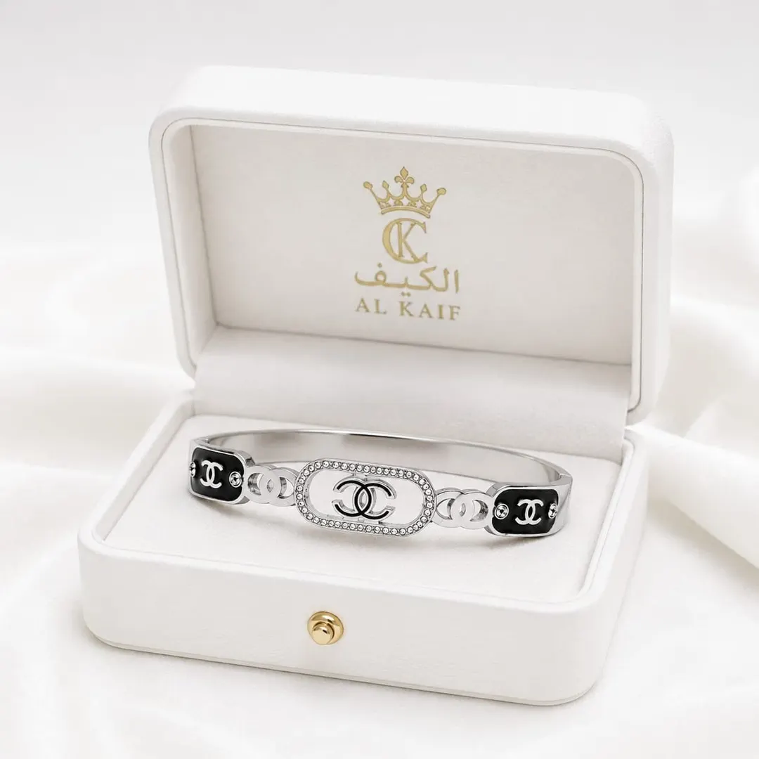 CHANEL INSPIRED ENAMEL & RHINESTONE CC LOGO BRACELET.