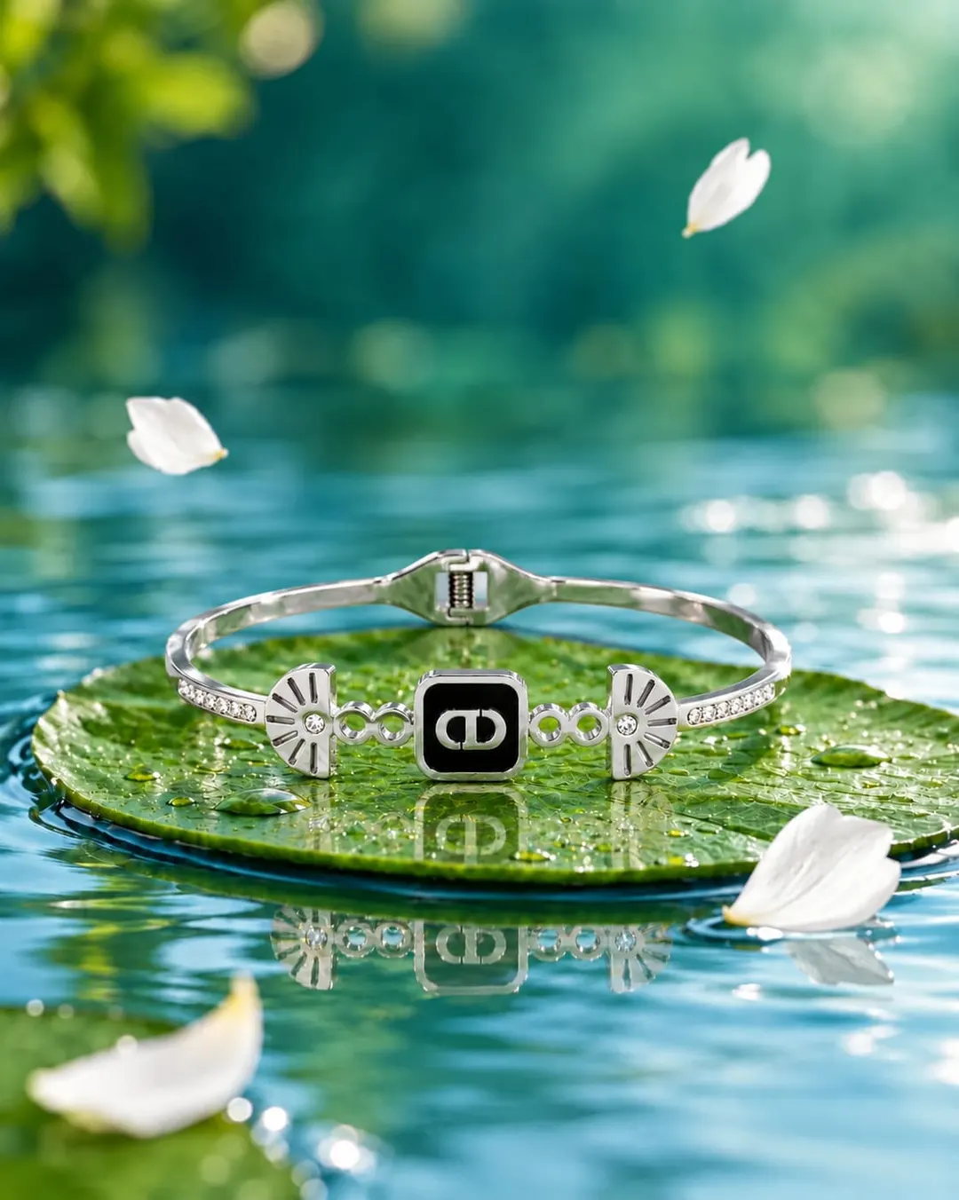 CHRISTIAN DIOR HINGED BRACELET WITH BLACK ENAMEL SQUARE CENTER PLATE SHOWCASING THE ICONIC "CD"SIGNARURE.
