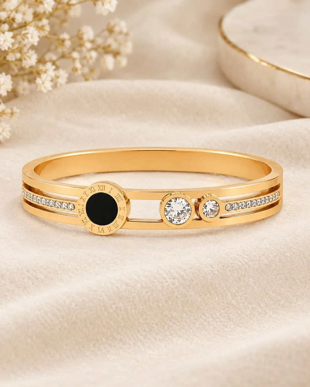 GOLD PLATED ROMAN NUMERAL STAINLESS STEEL CUFF BRACELET.
