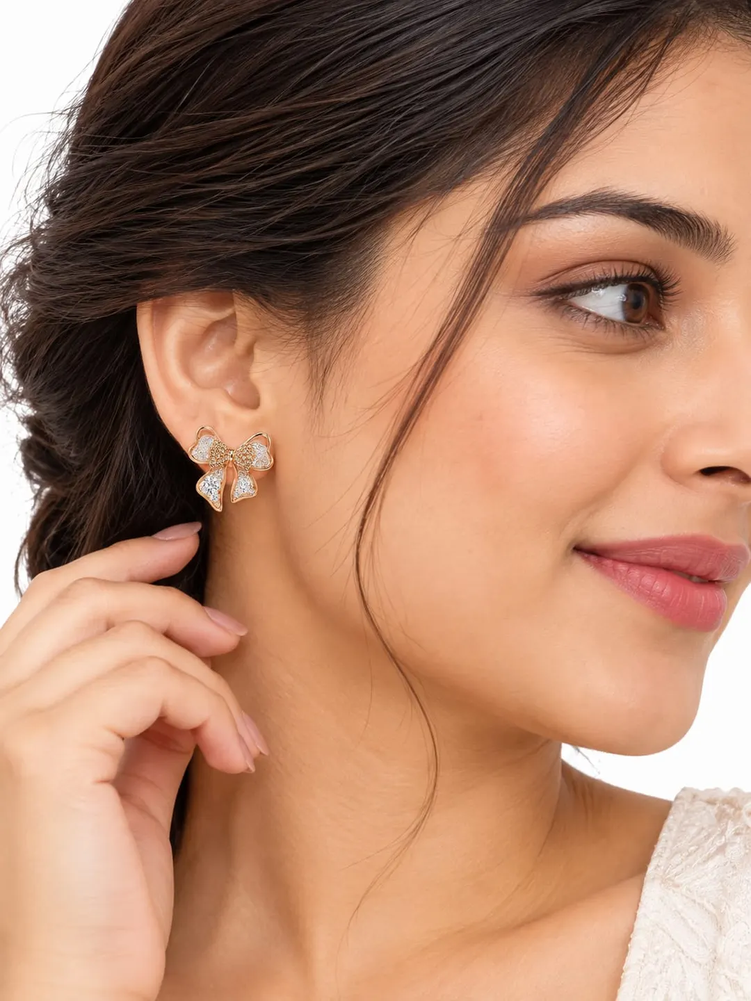 ROSE GOLD CRYSTAL BOW EARRINGS.