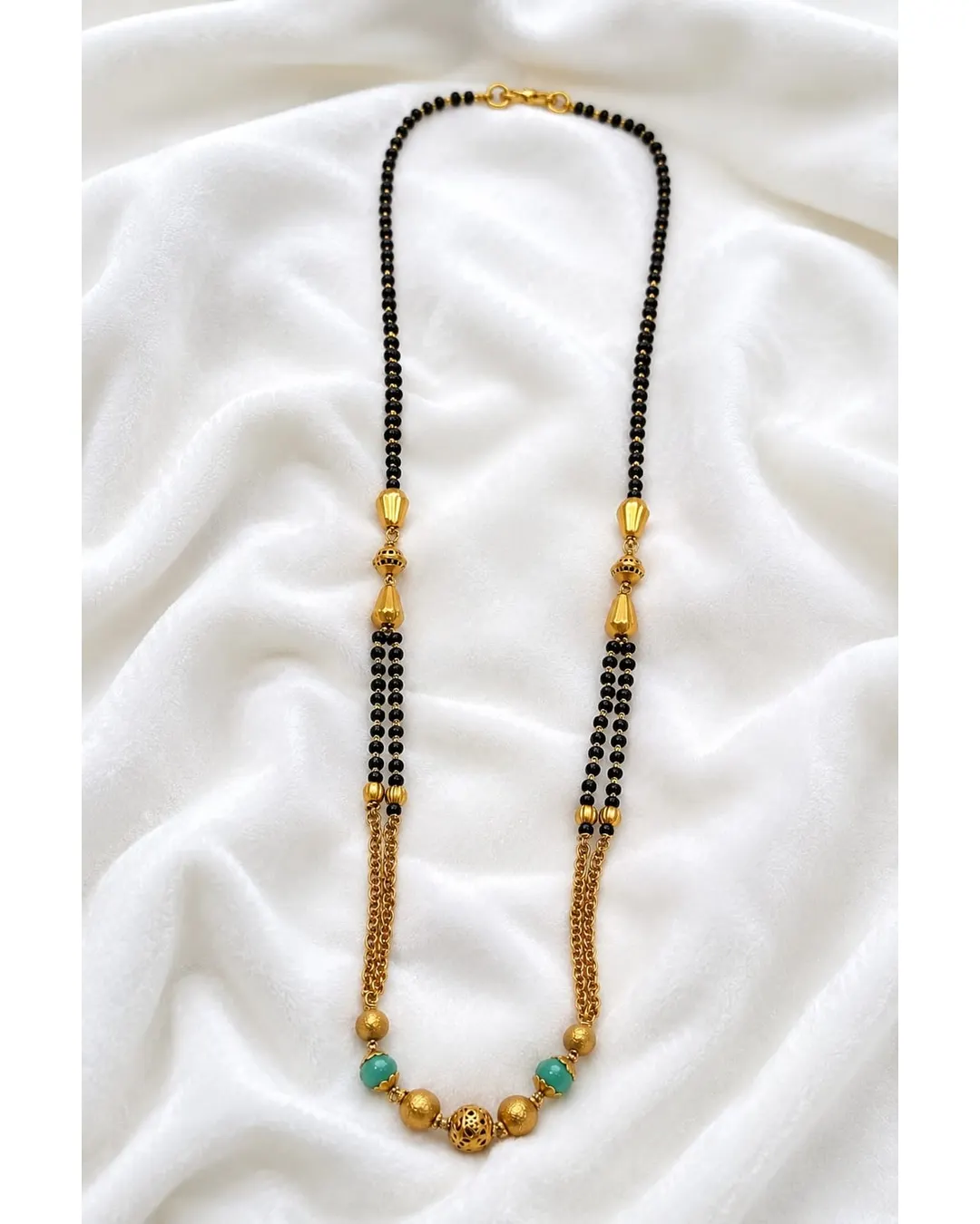 TRADITIONAL GOLD-TONE BLACK BEADED MANGALSUTRA WITH GREEN BEAD ACCENTS