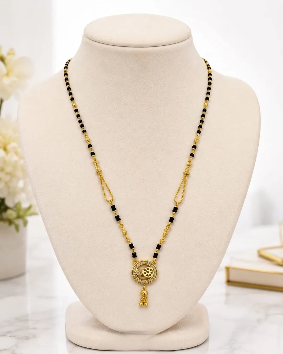 ELEGANT GOLD-TONED BLACK BEADED MANGALSUTRA NECKLACE ITH FLORAL ROUND PENDANT