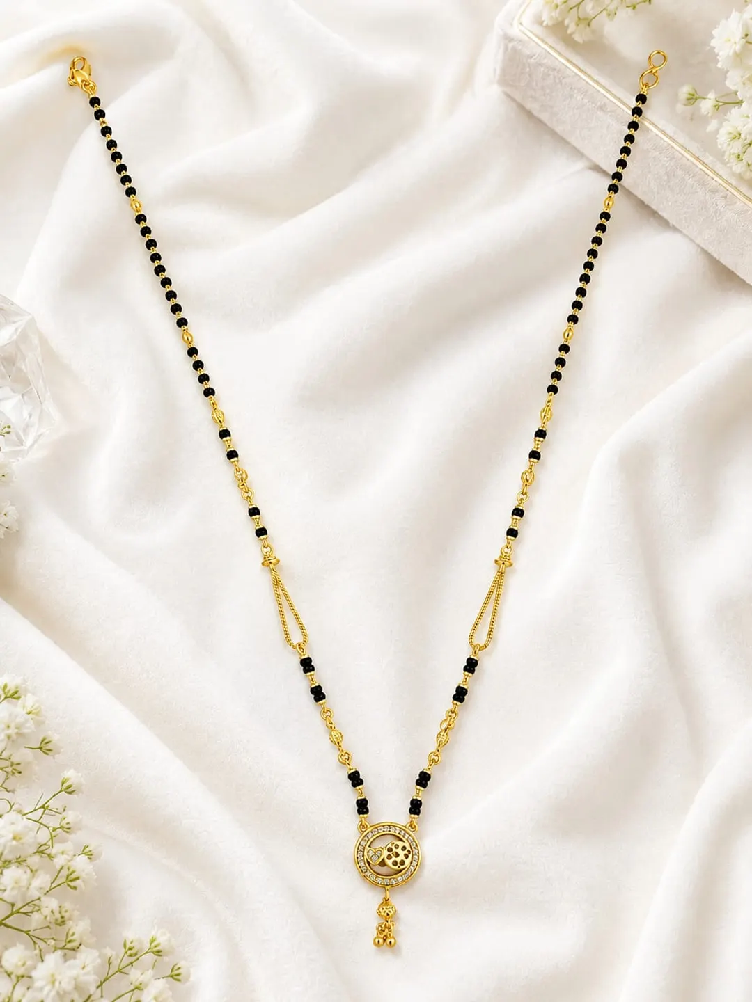 ELEGANT GOLD-TONED BLACK BEADED MANGALSUTRA NECKLACE ITH FLORAL ROUND PENDANT