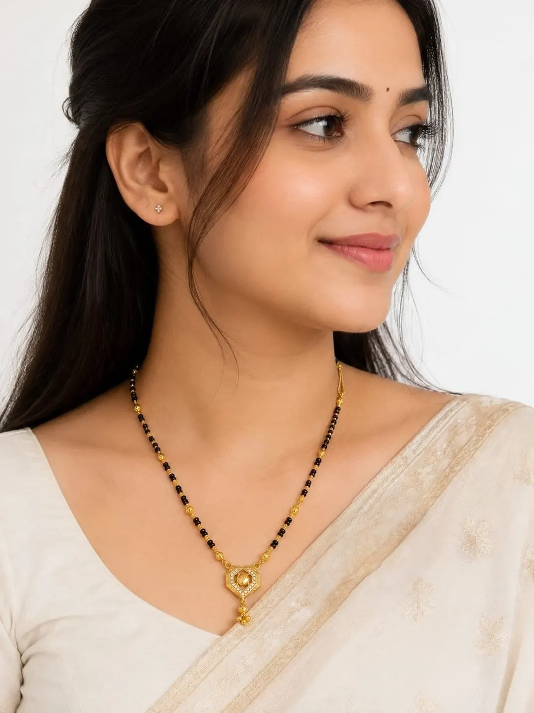 ELEGANT GOLD-TONED BLACK BEADED MANGALSUTRA NECKLACE WITH HEART-SHAPED PENDANT AND DANGLING CHARM