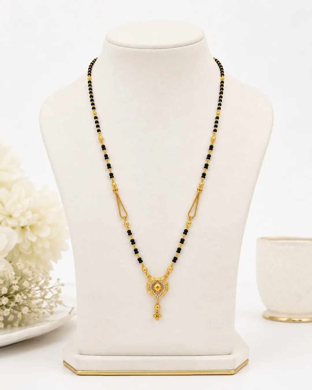 ELEGANT GOLD-TONED BLACK BEADED MANGALSUTRA NECKLACE WITH HEART-SHAPED PENDANT AND DANGLING CHARM
