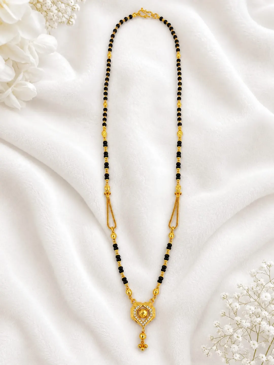 ELEGANT GOLD-TONED BLACK BEADED MANGALSUTRA NECKLACE WITH HEART-SHAPED PENDANT AND DANGLING CHARM