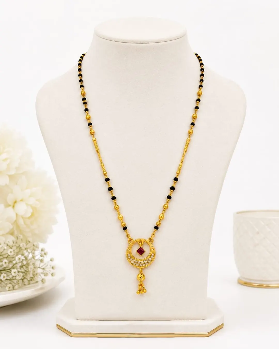 ELEGANT GOLD-TONE BLACK BEADED MANGALSUTRA WITH RED STONE PENDANT