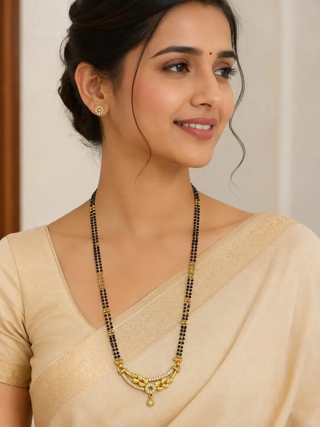 ELEGANT GOLD-TONE DOUBLE-LINE BLACK BEADED MANGALSUTRA WITH TRADITIONAL FLORAL DROP PENDANT