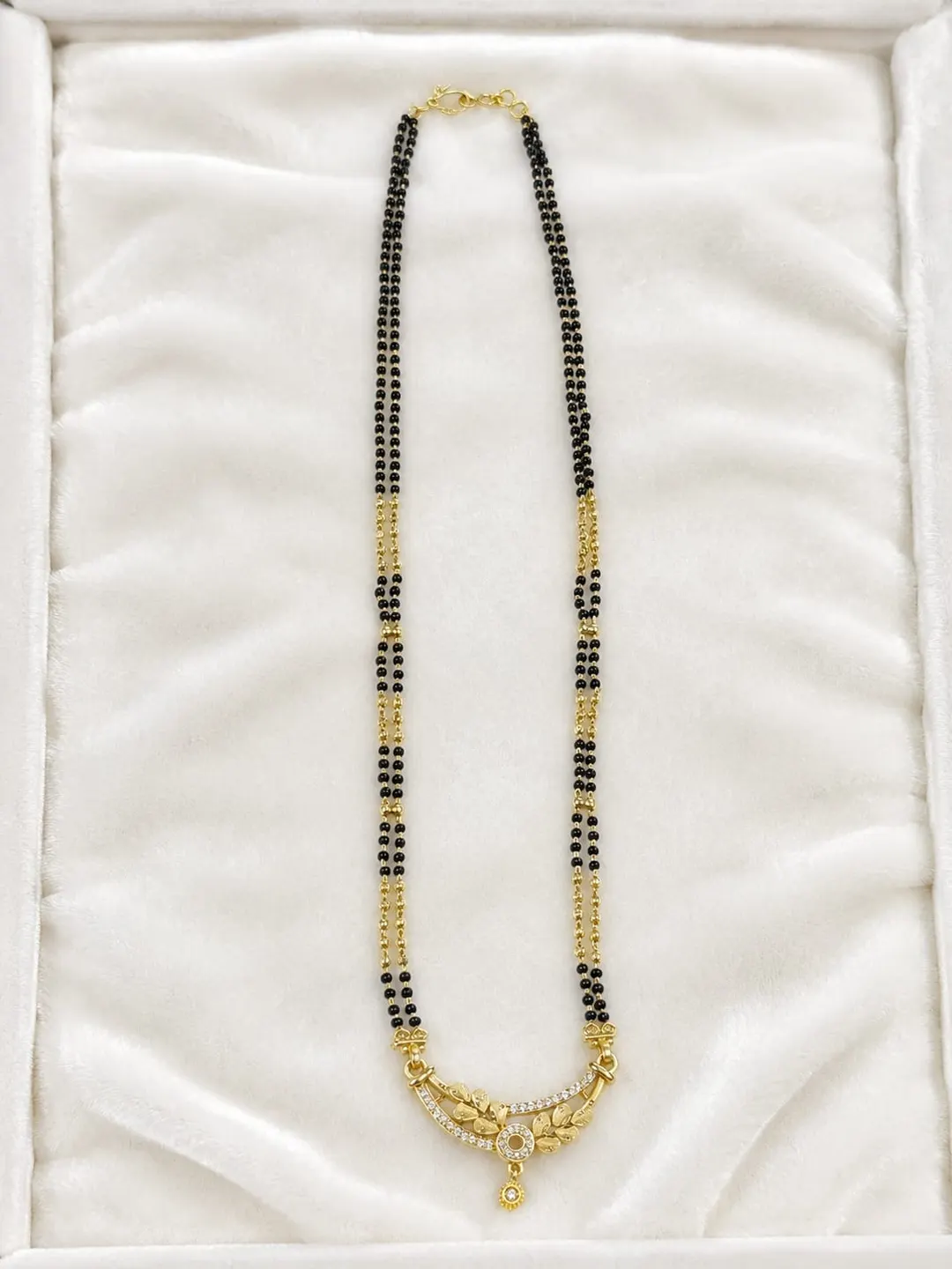 ELEGANT GOLD-TONE DOUBLE-LINE BLACK BEADED MANGALSUTRA WITH TRADITIONAL FLORAL DROP PENDANT