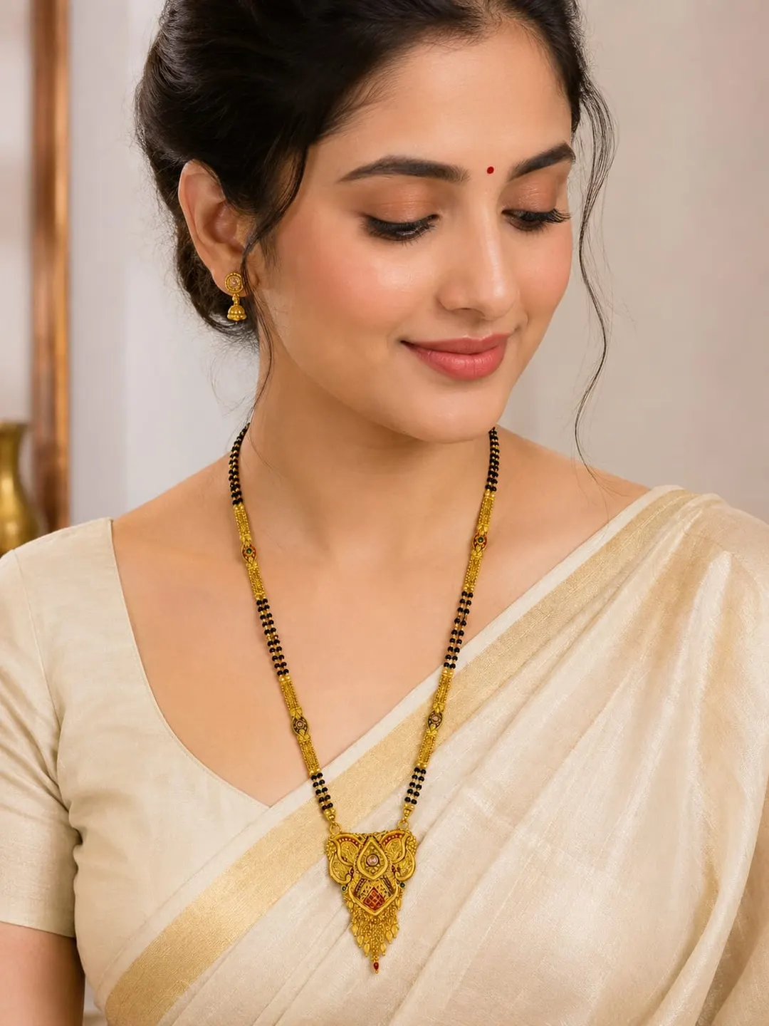 TRADITIONAL GOLD-TONE BLACK BEADED MANGALSUTRA WITH ANTIQUE PENDANT