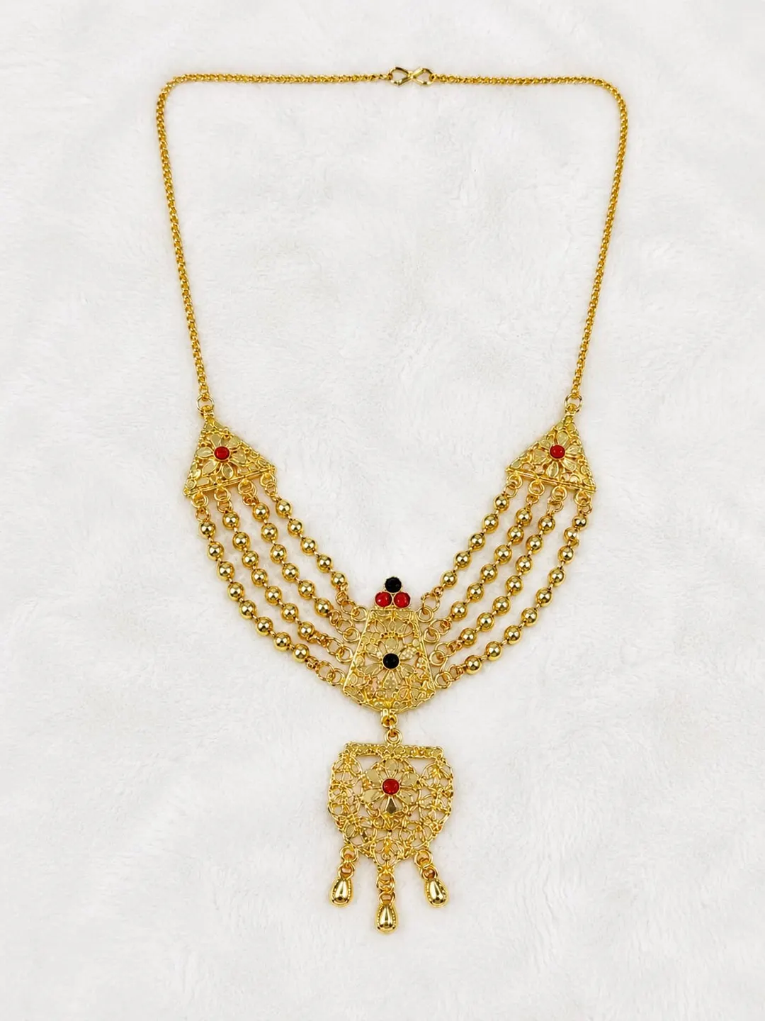 GOLD-TONE MULTI-STRAND RANI HAAR NECKLACE WITH RED & GREEN STONE ACCENTS AND ORNATE DANGLING PENDANT