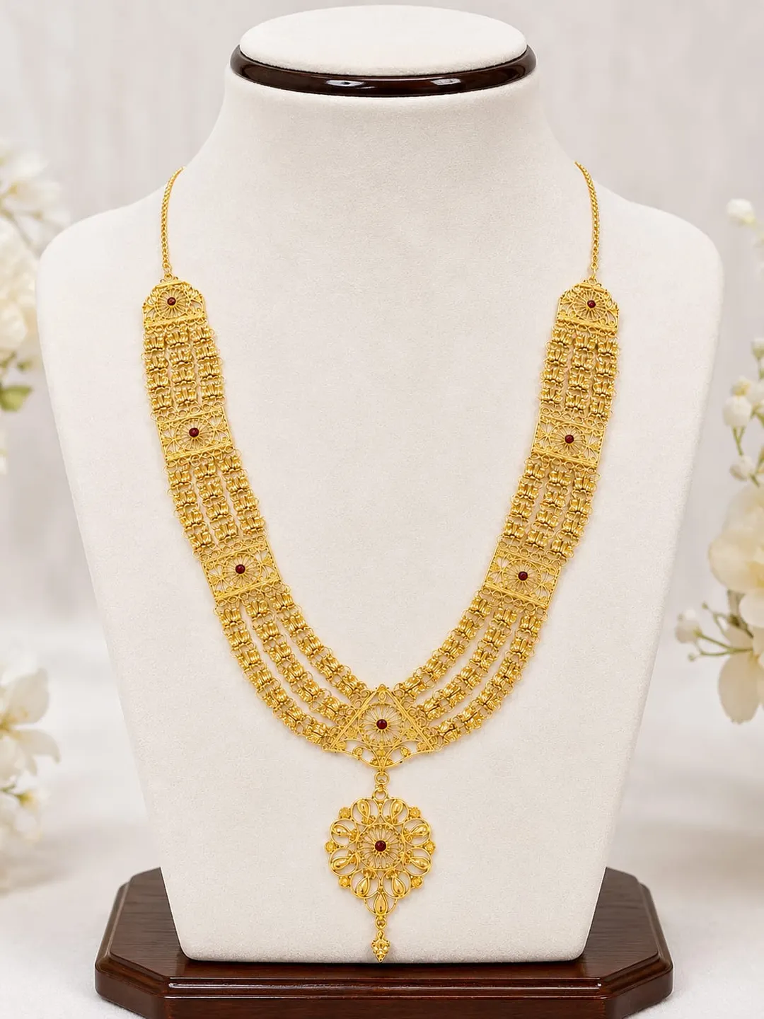 TRADITIONAL GOLD-TONE MULTI-LAYERED RANI HAAR NECKLACE WITH RED STONE  ACCENTS & FLORAL PENDANT