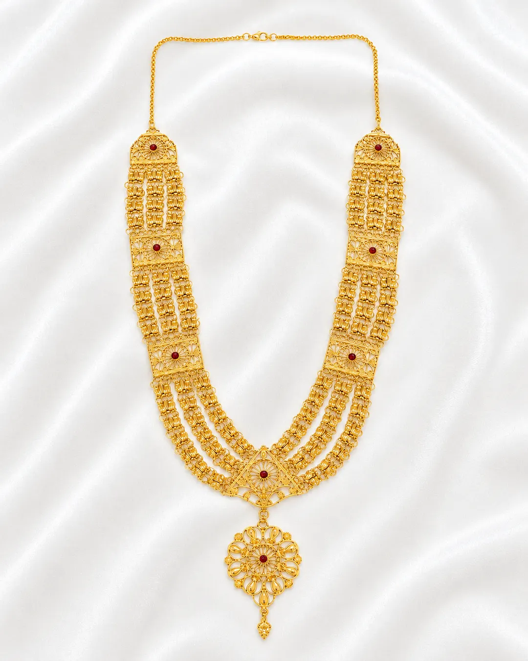 TRADITIONAL GOLD-TONE MULTI-LAYERED RANI HAAR NECKLACE WITH RED STONE  ACCENTS & FLORAL PENDANT