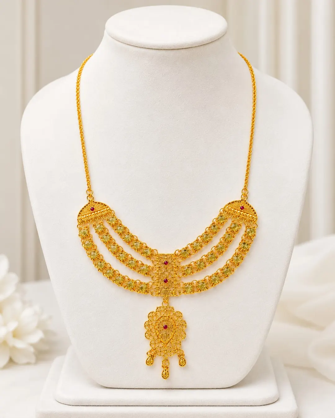 GOLD-TONE TRIPLE-LAYERED NECKLACE WITH RED STONE ACCENTS & FLORAL DANGLING PENDANT