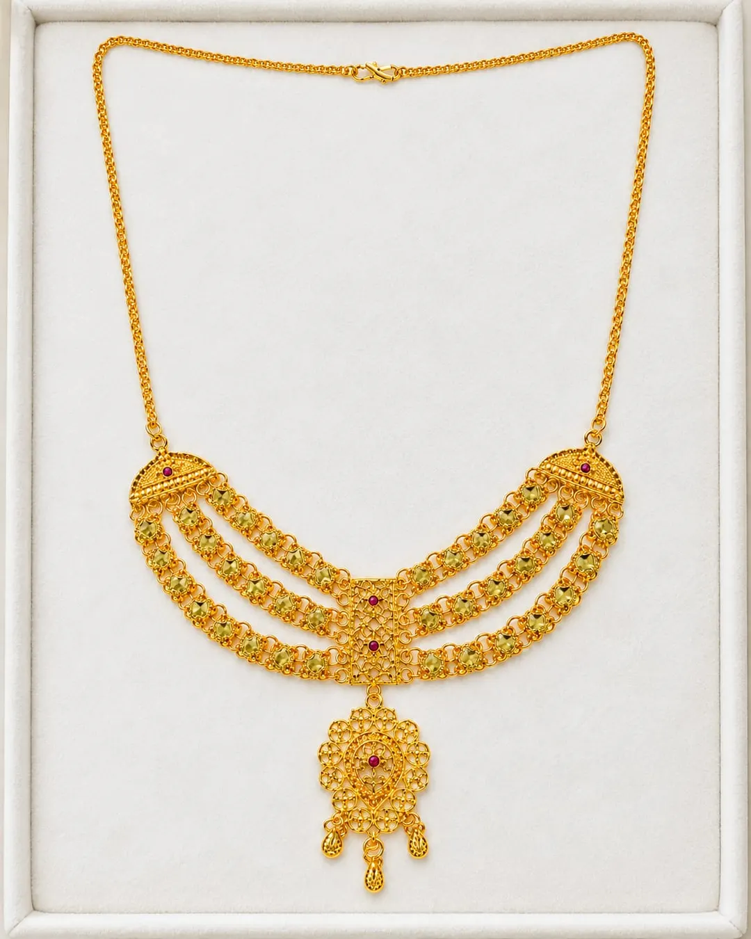 GOLD-TONE TRIPLE-LAYERED NECKLACE WITH RED STONE ACCENTS & FLORAL DANGLING PENDANT