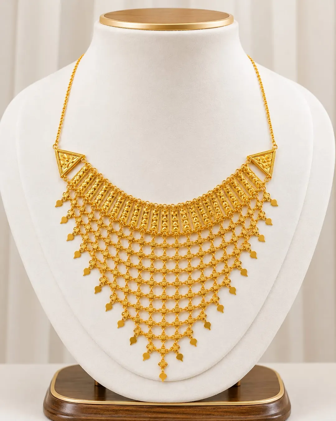 GOLD-TONE MULTI-LAYER JALI NECKLACE WITH LEAF DROPS