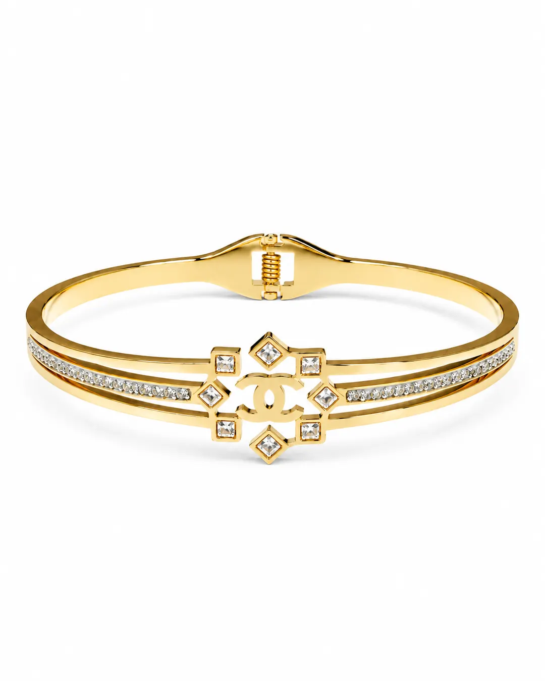 CHANEL GOLD TONE CYRSTAL EMBELLISHED HINGED BRACELET.