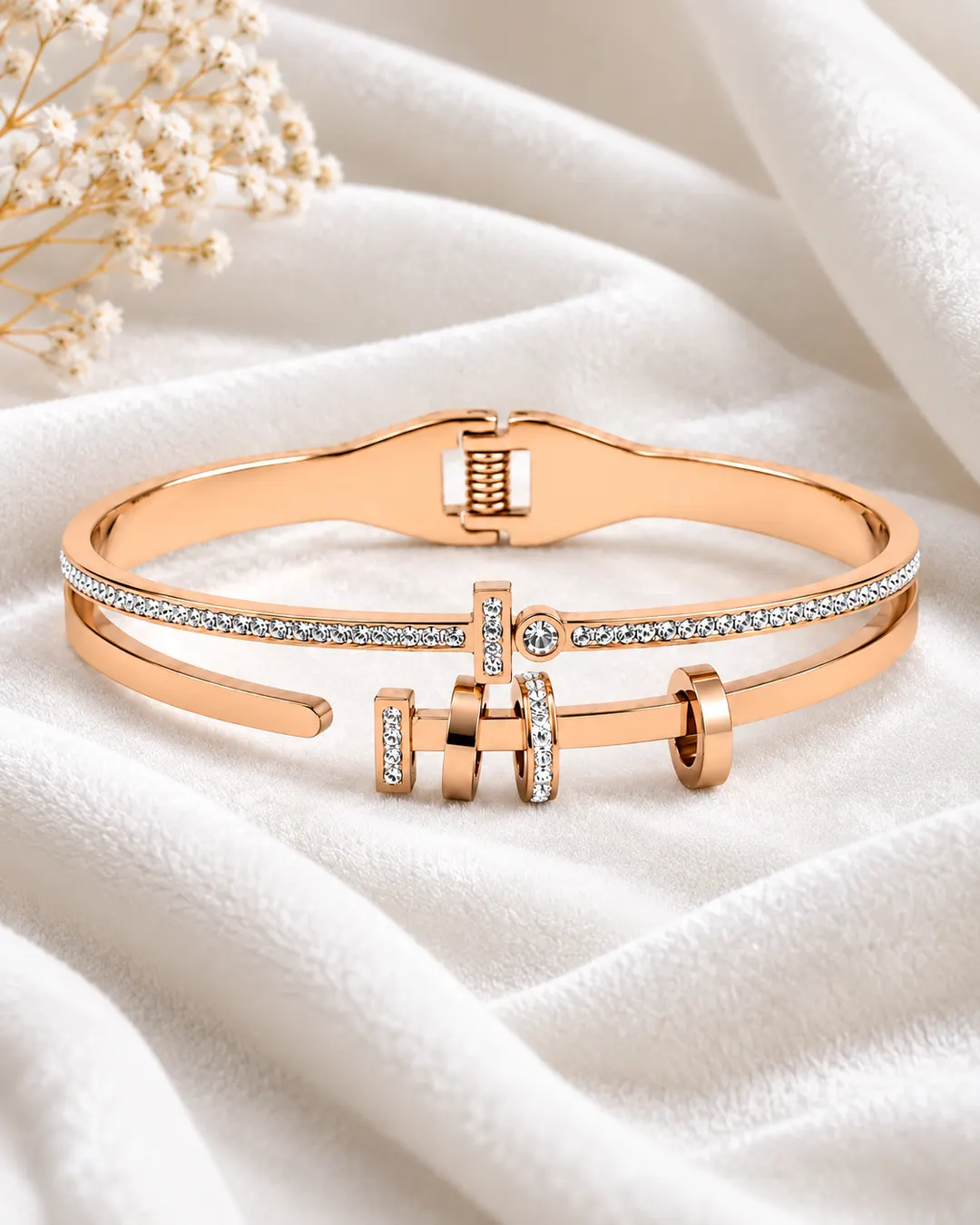 ROSE GOLD PLATED TITANIUM STAINLESS STEEL HINGED BRACELET.