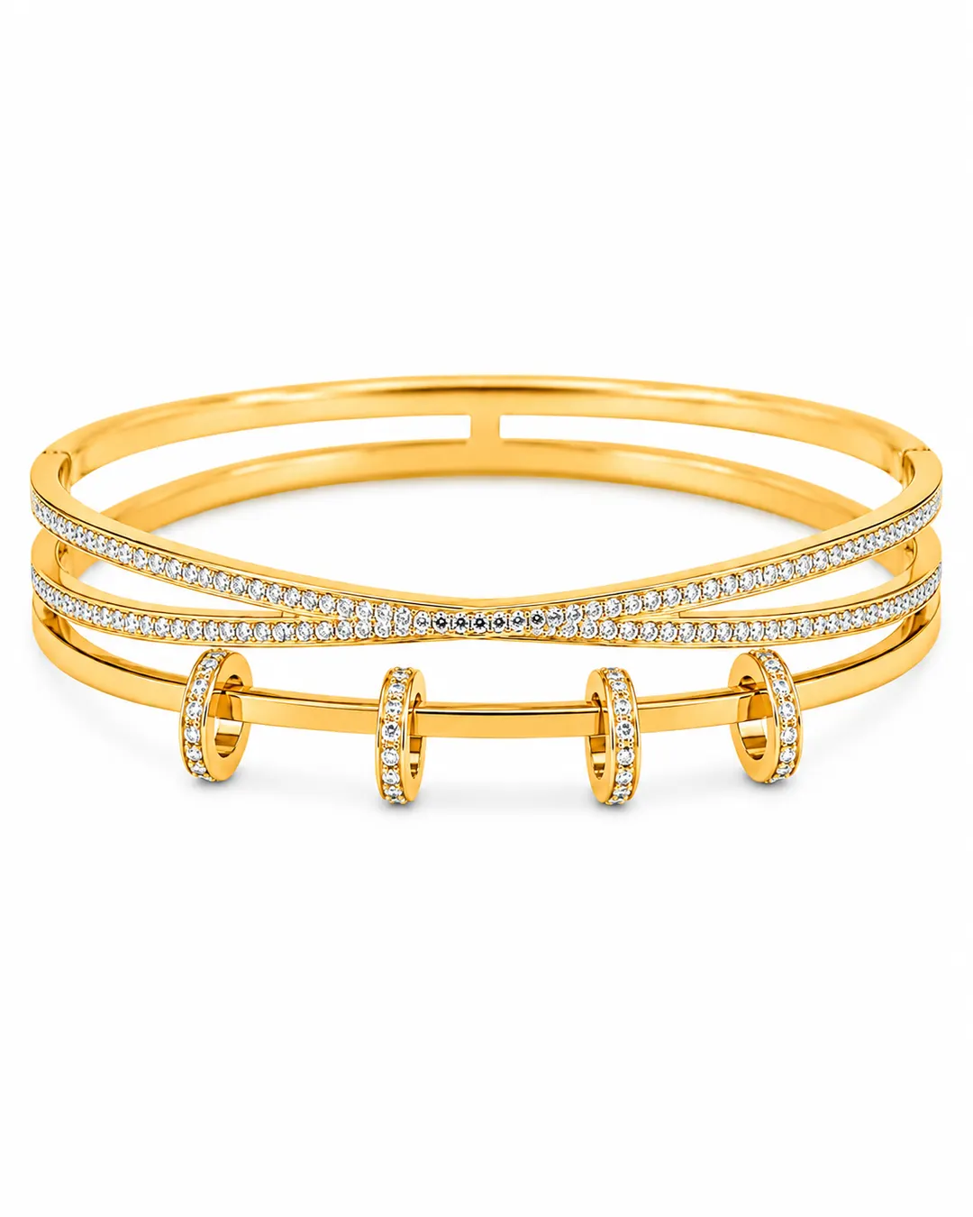 GOLD TONE CROSSOVER CUFF WITH SLIDING RING CHARMS.
