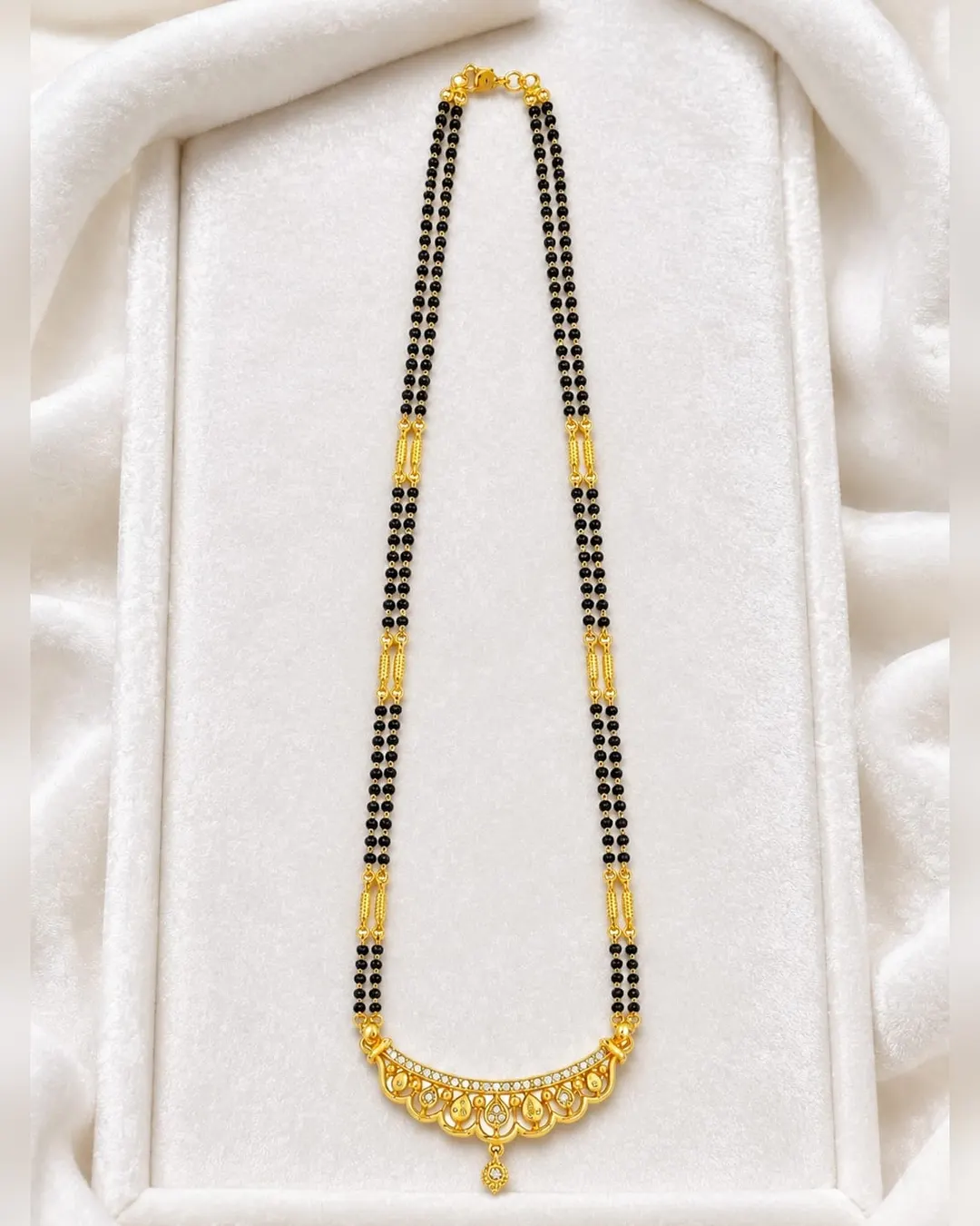 ELEGANT GOLD-TONE DOUBLE-LINE BLACK BEADED MANGALSUTRA WITH DESIGNER FLORAL PENDANT