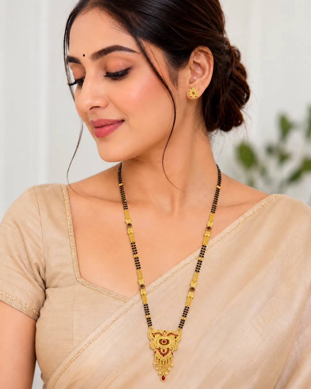 TRADITIONAL GOLD-PLATED DOUBLE-LINE BLACK BEAD MANGALSUTRA ITH DESIGNER PENDANT