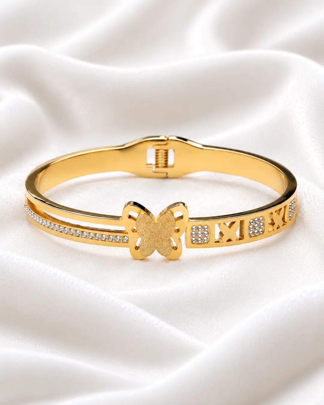 GOLD TONE BUTTERFLY MOTIF EMBELLISHED BRACELET.