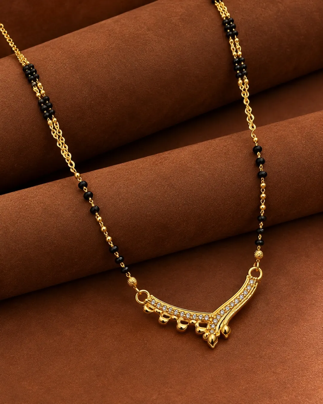 ELEGANT GOLD-TONE BLACK BEADS V-SHAPED AD STONE MANGALSUTRA