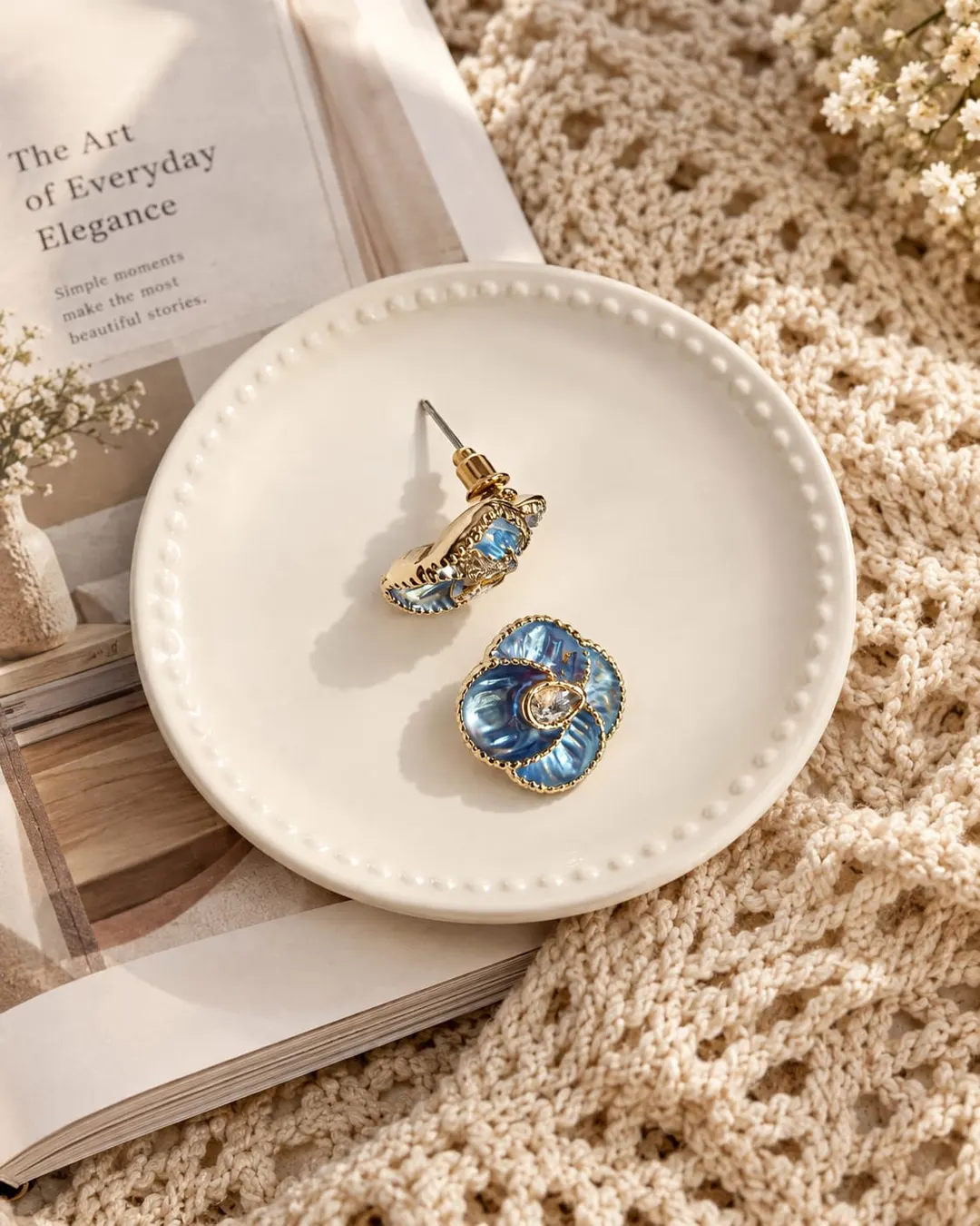 BLUE FLORAL ENAMEL STUD EARRINGS.