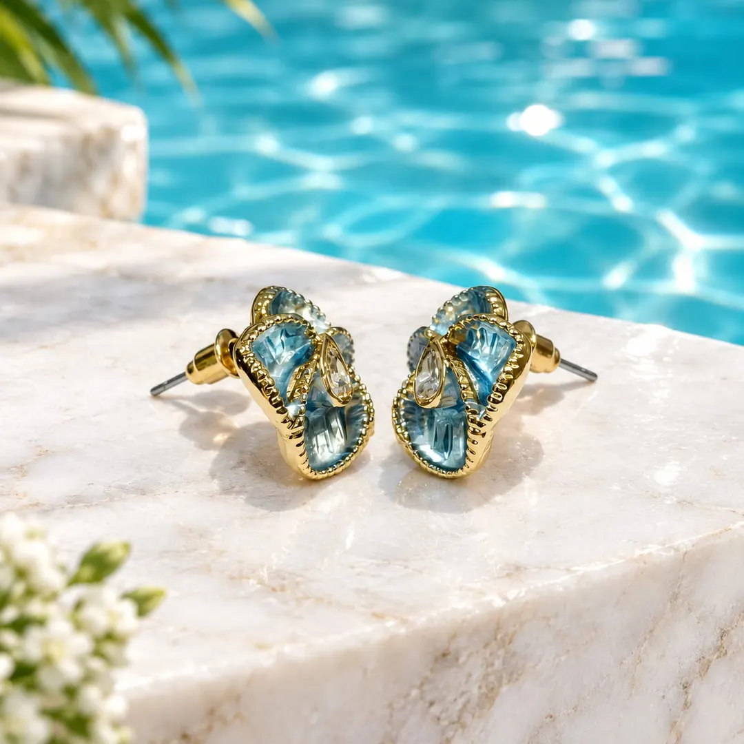 BLUE FLORAL ENAMEL STUD EARRINGS.