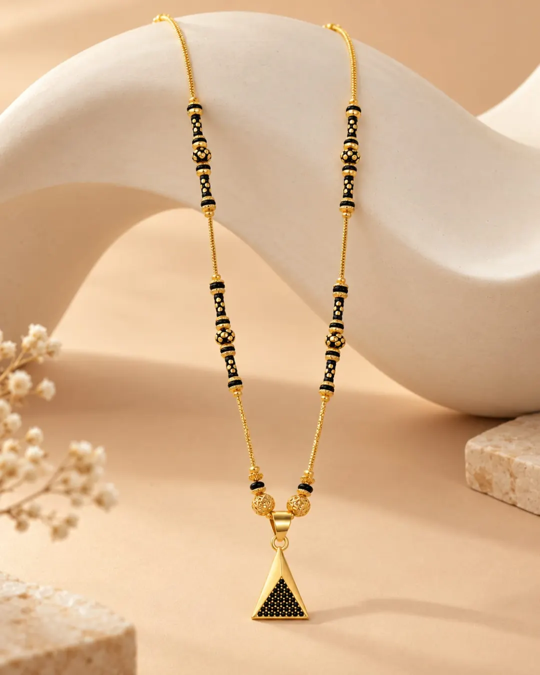 GOLD TRIANGLE BLACK BEADED MANGALSUTRA.