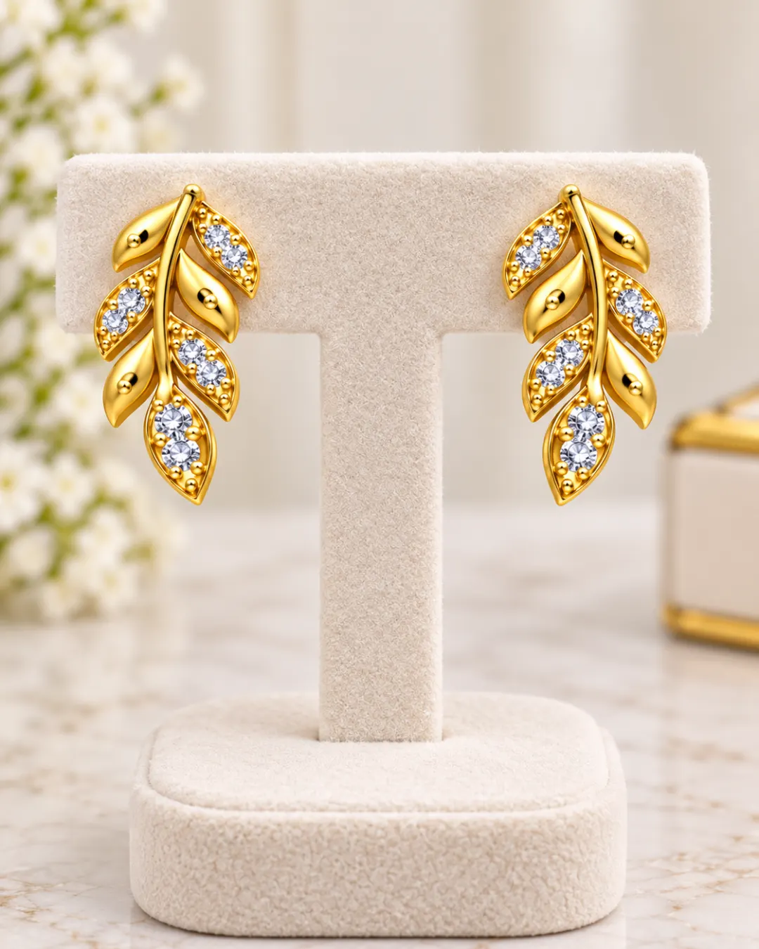 GOLDEN LEAF DESIGN STUD EARRINGS WITH CRYSTAL STONES