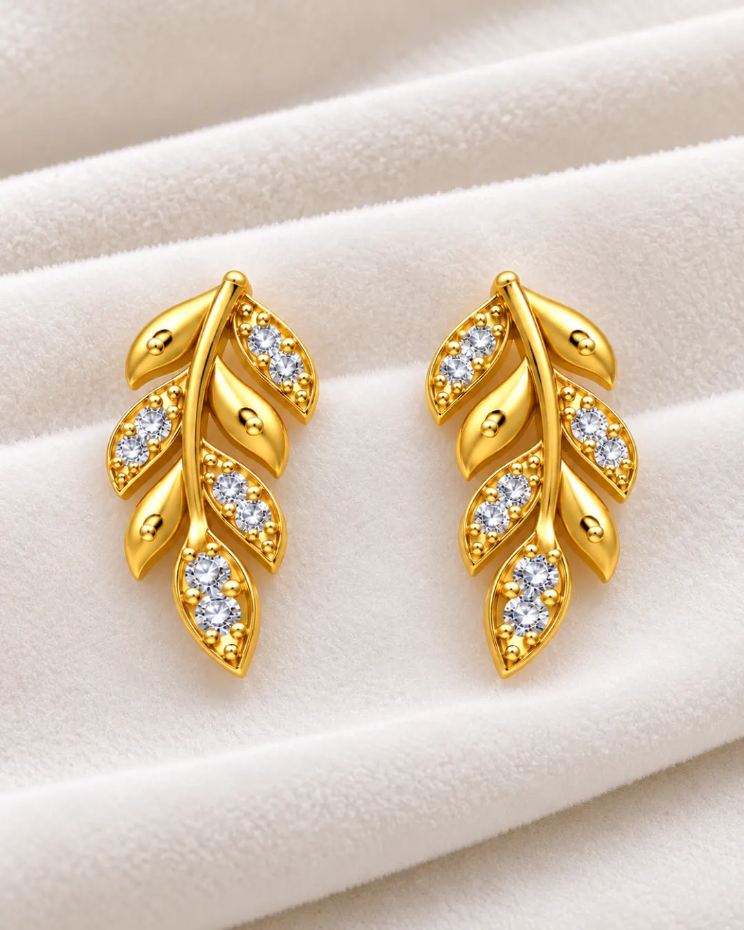GOLDEN LEAF DESIGN STUD EARRINGS WITH CRYSTAL STONES