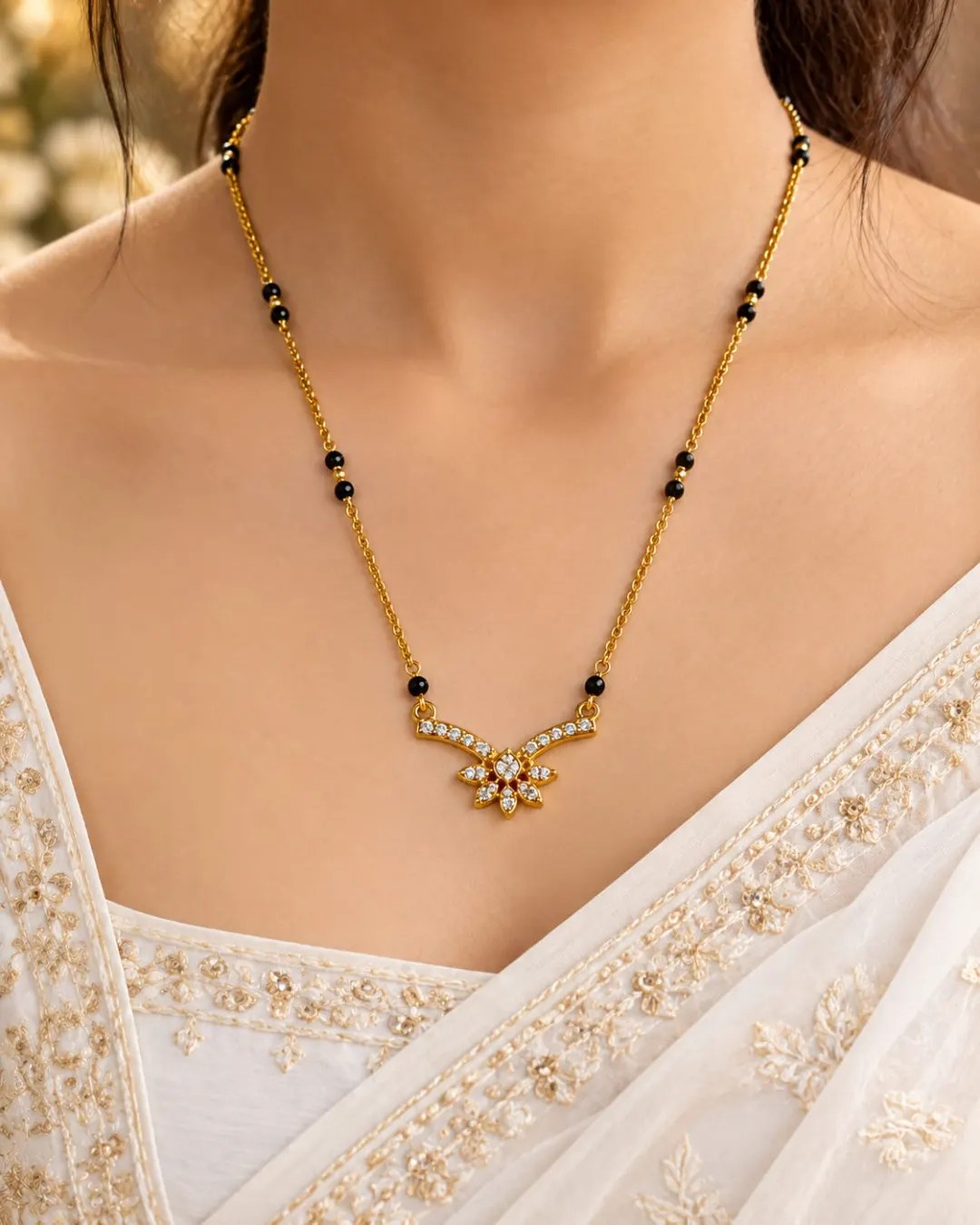 GOLD PLATED BLACK BEADS MANGALSUTRA WITH SPARKLING AD STONES FLORAL PENDANT